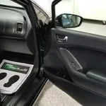 passenger door of car open to show clean, newly detailed interior